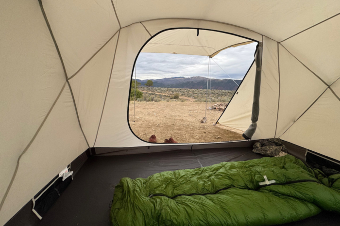 View from inside the Snow Peak tent through the open doorway toward the campsite