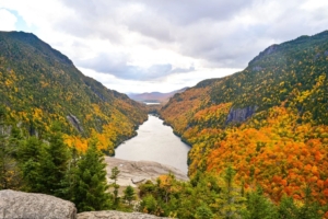 river surrounded by forests with changing leaves