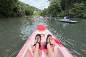 view of person's feet sitting in a kayak