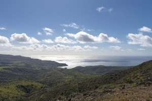 vista with blue sky, mountains, and ocean