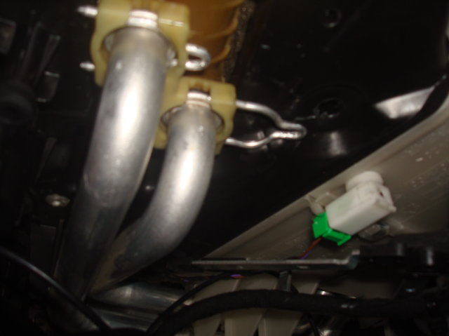 Remove the 2 aluminum clips slowly and gently using a screwdriver