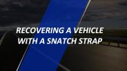 Recovering a vehicle with  snatch strap