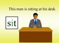 This man is sitting at his desk. PowerPoint PPT Presentation