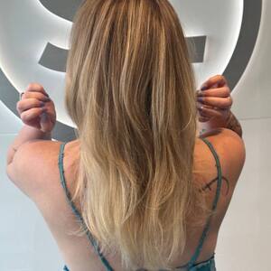 Pin5 blonde long back view arms up 1200x1500
