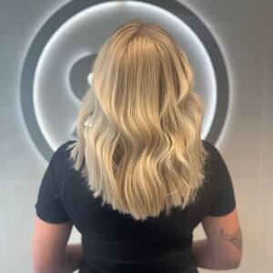 Pin5 blonde wavy back view salon lofts 2 1200x1500