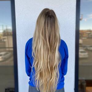 Pin5 blonde wavy back view blue top 1200x1500
