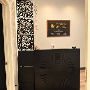 Warmly lit therapeutic massage room 5