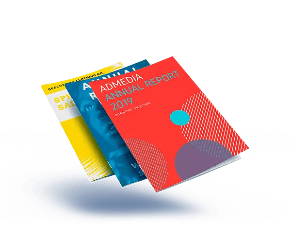 Magazines fanned in a stack, red annual report cover in front