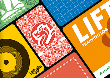 Graphic design services shown as colorful printed card designs overlapping