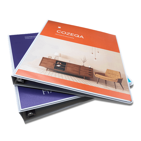 Custom binders stacked, orange furniture catalog cover over purple cover
