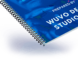 Spiral bound booklet with a blue cover and silver plastic coil