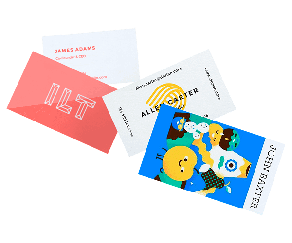 Classic Business Cards Four classic business cards scattered, including a coral ILT card and a colorful illustrated card