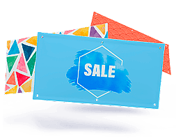 Banner with blue SALE design and grommets, two patterned banners behind
