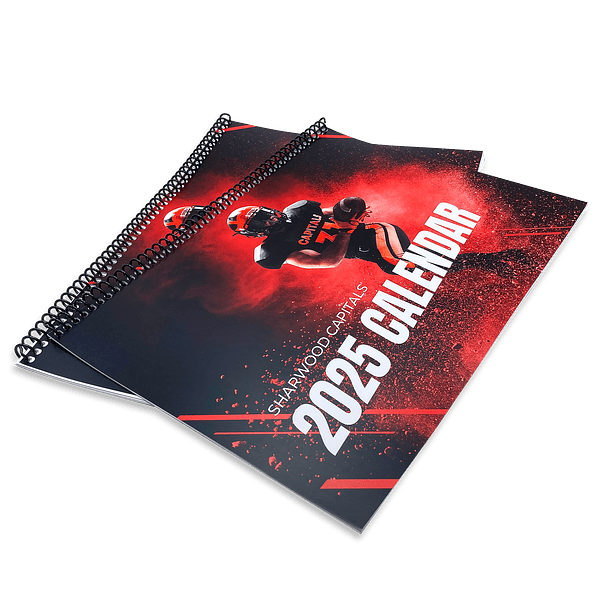 Spiral Bound Booklet Printing Spiral bound booklet printing with a black plastic coil binding, laid flat.