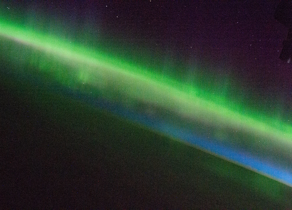 An Aurora Glows Above Earth's Horizon 
