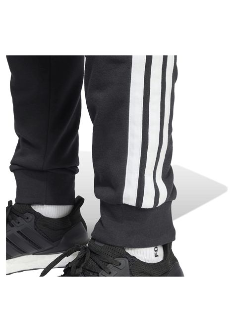 Pantaloni Adidas Essentials French Terry Tapered Cuff 3 Stripes Nero Bianco Uomo ADIDAS CORE | Pantalone | JD1881-