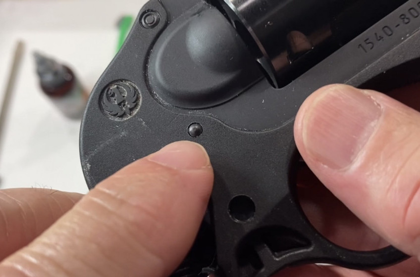 Locate this pin on the right side of the gun.