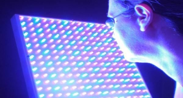 blue and red light therapy session on face
