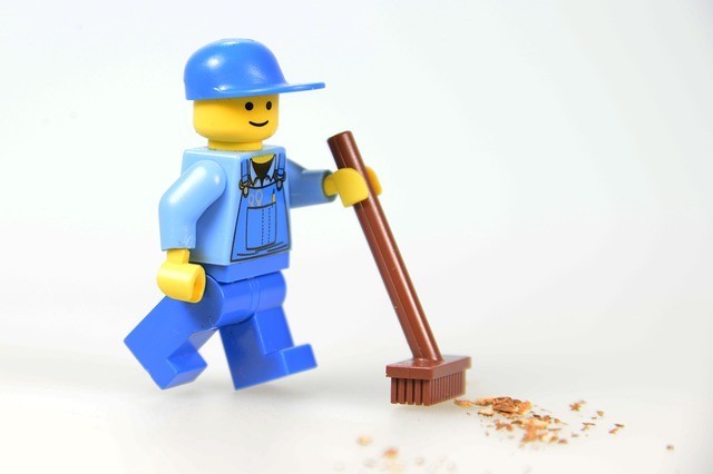 lego man with a broom