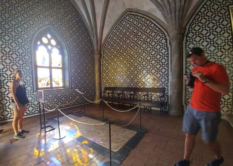 Man stares at camera whilst walking into shot
