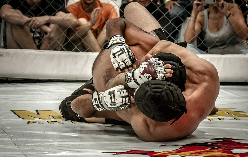Twoo MMA Fighters Grappling on the Mat