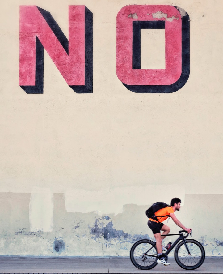 NO written in red with black frame and a biker below NO written in red with black frame and a biker below