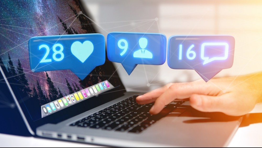 laptop showing social media likes, messages, friends laptop showing social media likes, messages, friends