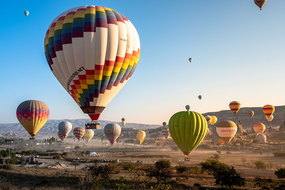 Hot air balloons drifting at sunrise