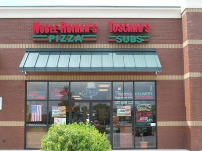 Noble Romans &amp; Tuscano Subs Logo
