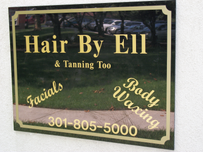 Hair and Tan by Ell Logo