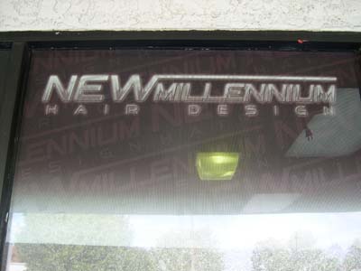 The New Millennium Barber Shop Logo