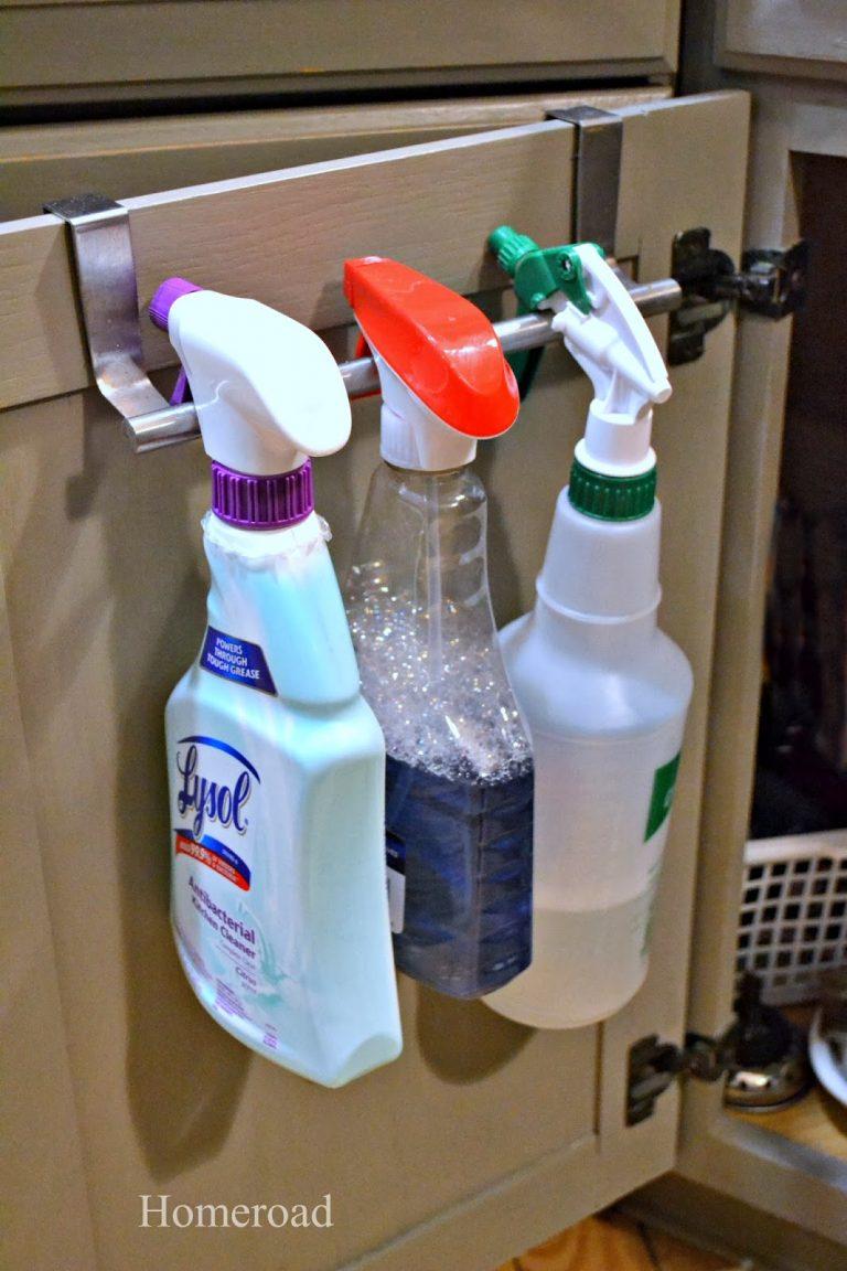 Hanging cleaning supplies on towel bar.
