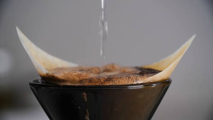 The Most Delicious Reason Not To Throw Away Used Coffee Grinds