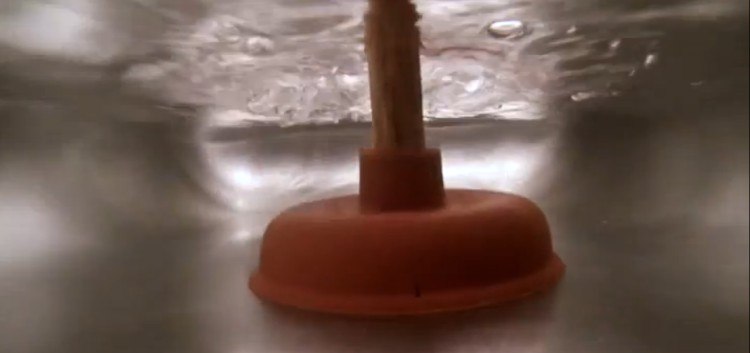 sink plunger submerged in water