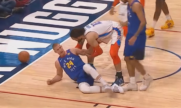 Basketball Player Saves Other Player From Scary Fall Instead of Scoring