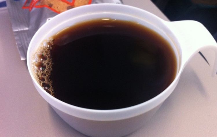 airplane coffee cup on tray table