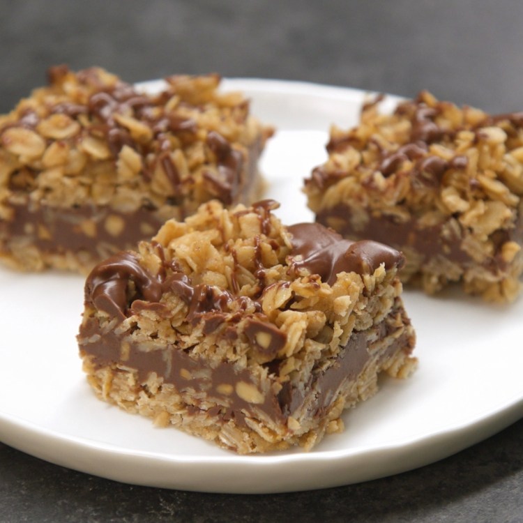 3 no-bake chocolate oat bars on white plate