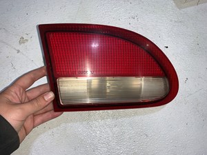 1995-1999 Chevy Cavalier Tail Light LH Drivers OEM 16519343