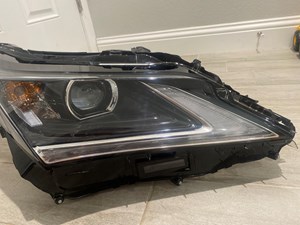 16-19 Lexus RX 350/450h Headlight passenger side.  1EJ 945 250-02