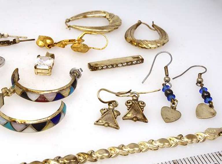 Assortment of Earrings, Pedants, Rings, Bracelet, & 16in Chain