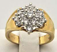 LADIES 14 KT GOLD AND DIAMOND CLUSTER RING.