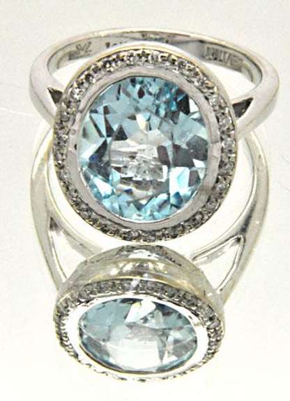 LADIES 14 KT WHITE GOLD BLUE TOPAZ AND DIAMOND RING.