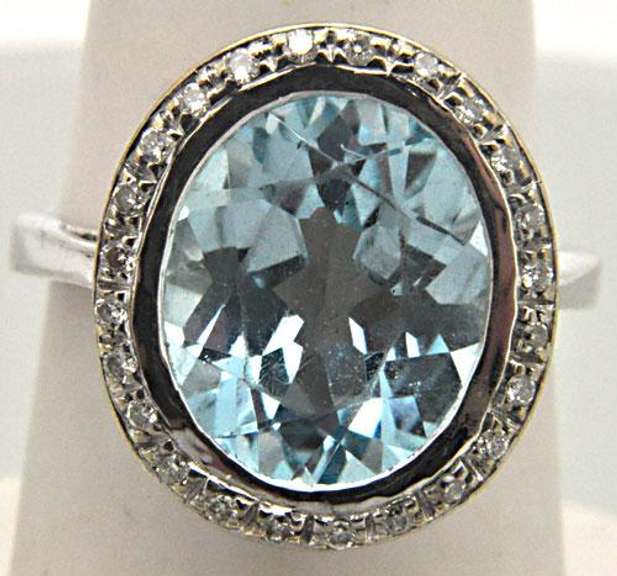 LADIES 14 KT WHITE GOLD BLUE TOPAZ AND DIAMOND RING.