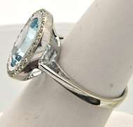 LADIES 14 KT WHITE GOLD BLUE TOPAZ AND DIAMOND RING.