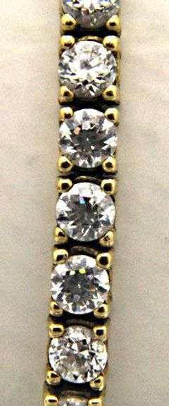 LADIES 14 KT YELLOW GOLD TENNIS BRACELET.