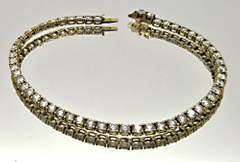 LADIES 14 KT YELLOW GOLD TENNIS BRACELET.