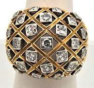 LADIES 18 KT YELLOW GOLD DIAMOND DOME RING.