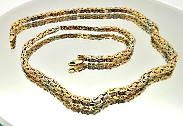 18 KT WHITE AND YELLOW GOLD BYZANTINE CHAIN.