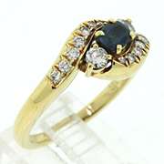 Graceful Blue Sapphire & Diamond Bypass Ring