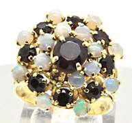 LADIES 18 KT YELLOW GOLD GARNET AND OPAL PYRAMID RING.